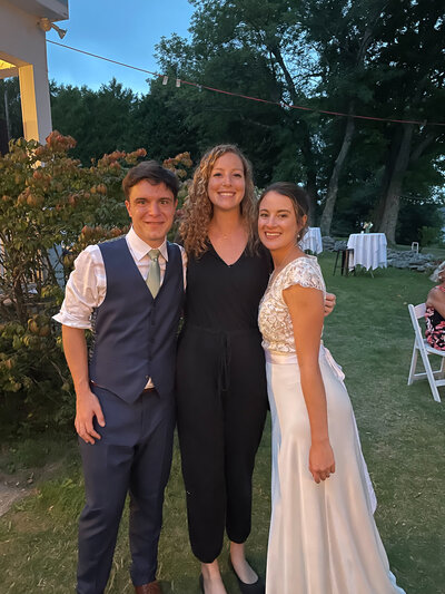 photographer with bride and groom