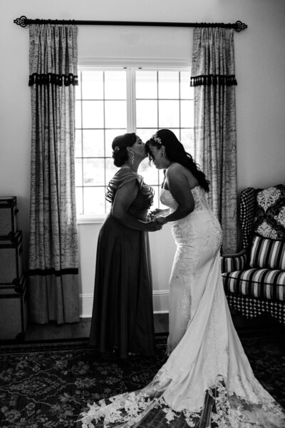couple laughing together at their long beach wedding