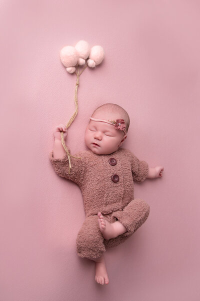 BABY HOLIDNG PINK VELT BALLOONS PINK BACKDROP