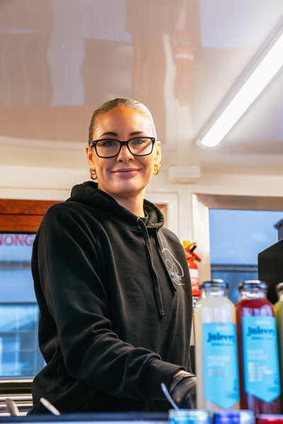 Kaylah smiling from Core Coffee & Co Mobile Van
