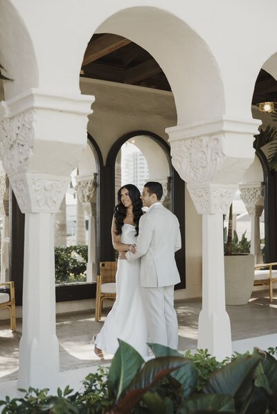 bride and groom poses for photos after wedding