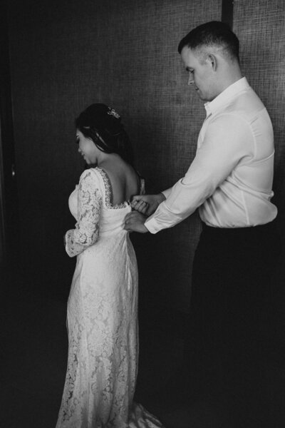 J zipping up M's dress