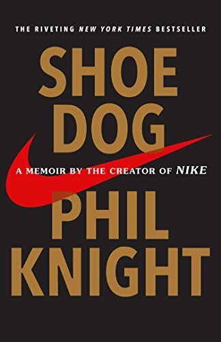Black book cover with gold letters and orange nike sign