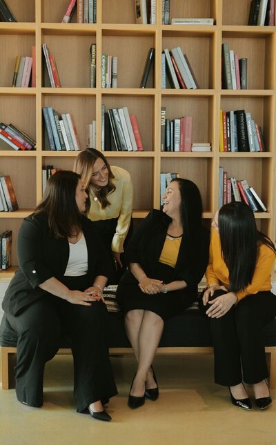 Five professional women standing together and smiling. This is the Relationship Experts team of infidelity therapists. They offer affair recovery and betrayal trauma treatment in the United States, Canada, and the UK. Schedule a consultation to work with one of them.