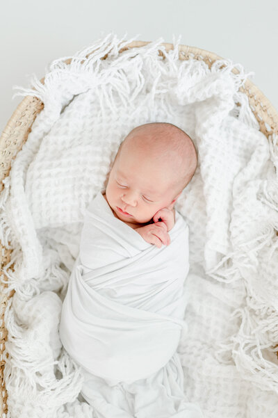 newborn in white swaddle by Nashville portrait photographer Kristie Lloyd