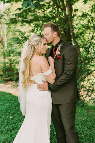 Bride and groom wedding portraits taken at 4 Points Farm, a rustic wedding venue in Sevierville, TN.