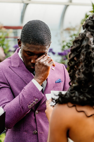 candid moment of groom crying during vows, emotional wedding storytelling by aim true photography