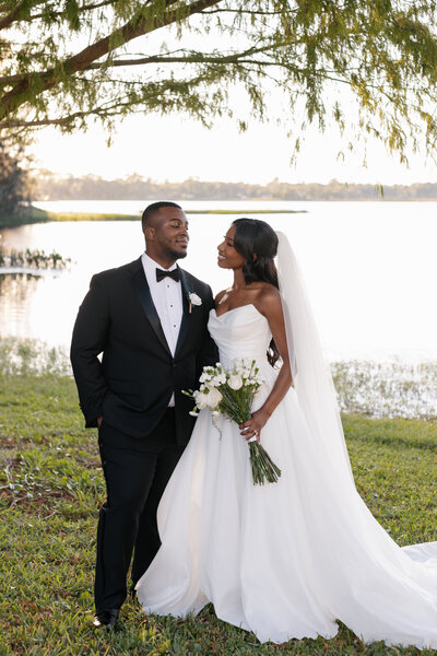 indie west portfolio image of bride and groom walking away from venue on wedding day