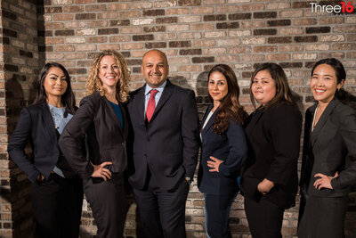 Members of a law firm pose together for their corporate photo session