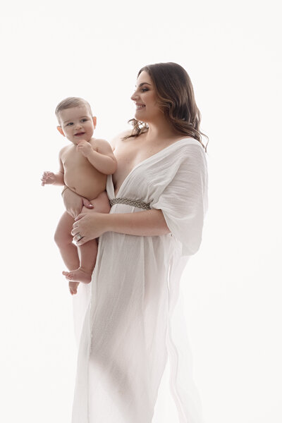 A mom holding her 6 month old baby