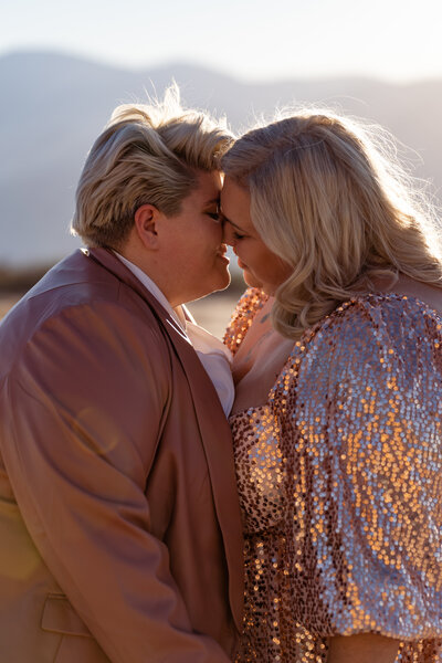 A couple standing close together about to kiss