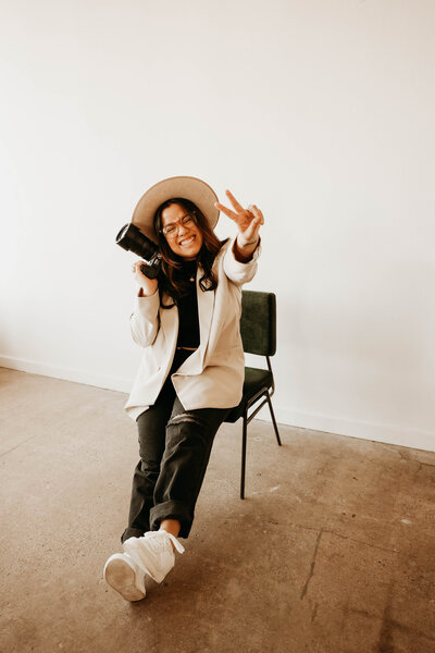 woman sitting on stool and looking into the distance