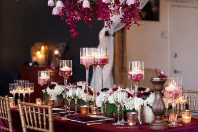 Candles and florals on a tablescape.
