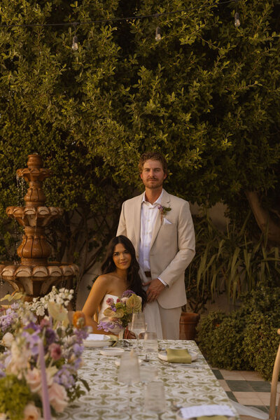 bride and groom pose for portraits after wedding in arizona