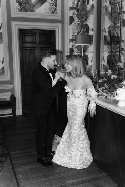 Wedding photographer captures couple taking a stroll hand in hand at their french chateau wedding.