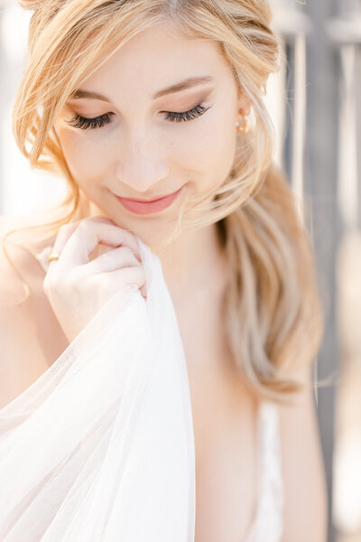 bright light and airy wedding photo of bride  in wedding dress