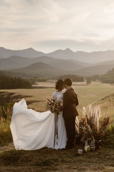 Earthy and eclectic elopement, bridal gown Bride wearing stunning two piece lace bridal gown from Cameo & Cufflinks, a contemporary bridal boutique based in Calgary, Alberta. Featured on the Brontë Bride Vendor Guide.