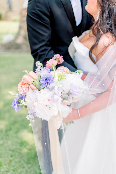 gorgeous detailed photograph of bride's pastel floral bouquet by arkansas wedding photographer