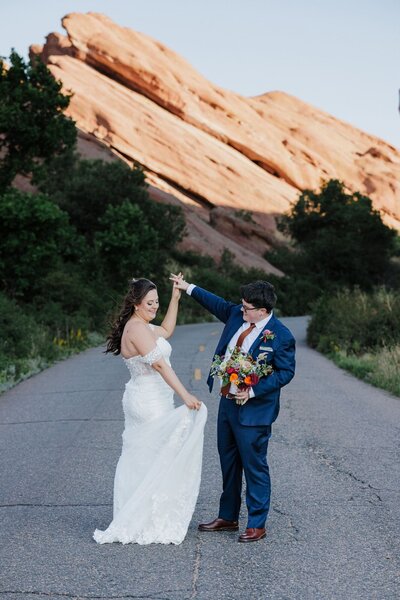 LGBTQ brides dance happily during stress-free Colorado elopement.