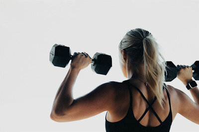 Woman lifting dumbbells during a fitness routine