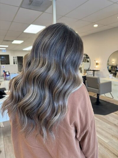 Brunette with soft waves and dimension