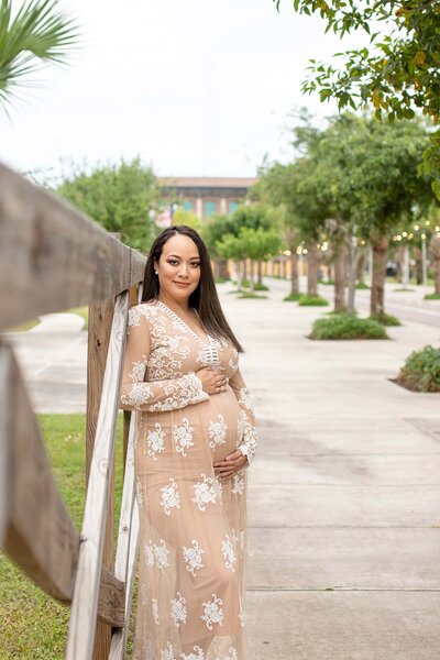 Pregnant mom in white maternity dress