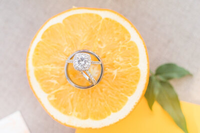 Halo ring balancing on top of orange slice