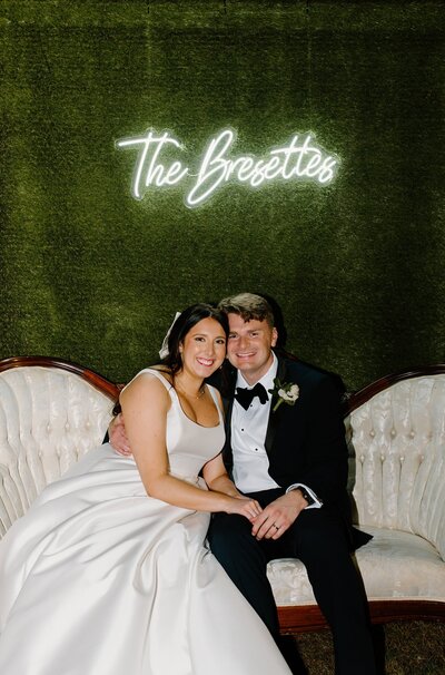 Bride and groom posing at the camera