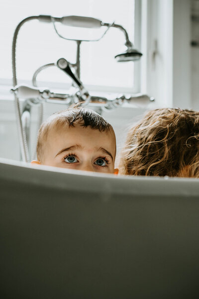 Boy in bath In-home family photography session Motherhood