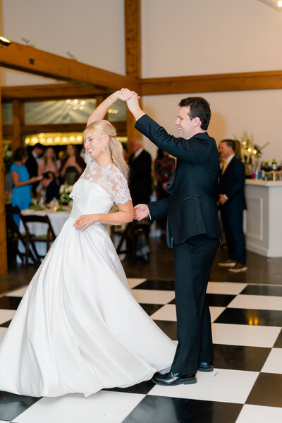 A married couple wiping away tears during their wedding ceremony
