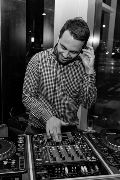 Male DJ bringing the vibes to a celebratory 30th party event