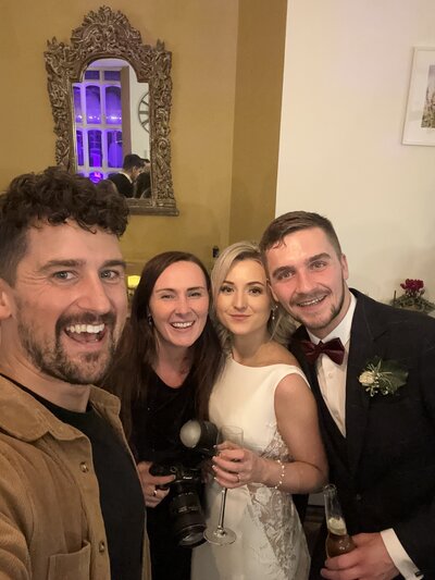 Amy & Nick posing with couple