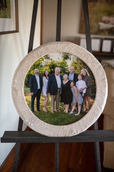 round whitewashed framed photoblock of large family