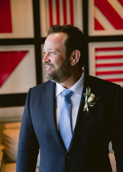 smiling groom with boutonniere