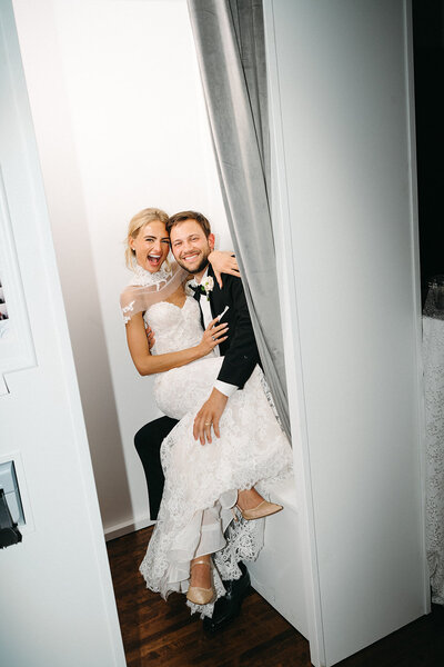 Bride and groom at their wisconsin wedding in the photobooth