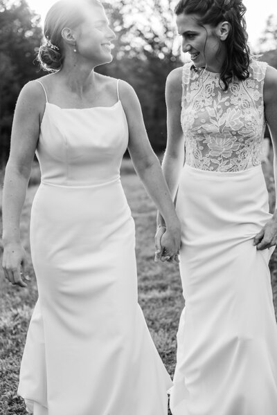 two brides at the alter with their bridesmaids