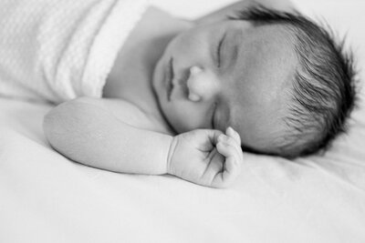 Black and white newborn baby sleeping by Miami Newborn Photography