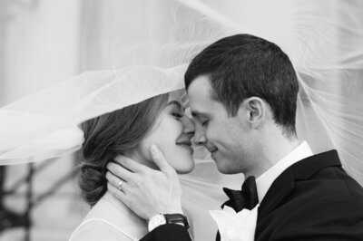 Bride and Groom Under Veil for wedding photography