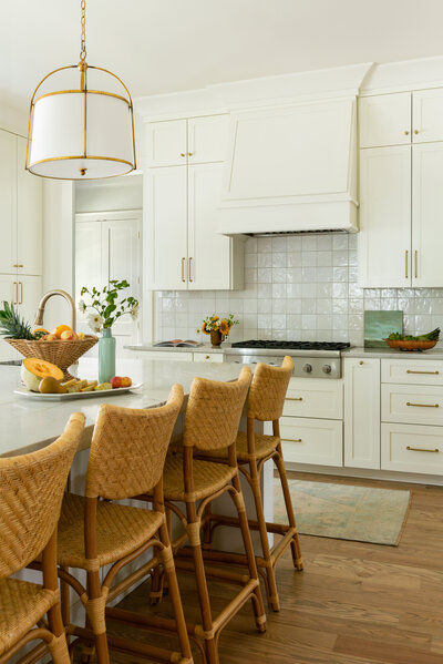 Buffet with two lamps and vase of hydrangeas