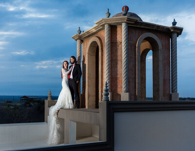Stunning rooftop photo of bride and groom at sunset at Stoney Ridge Villa in Azle Texas
