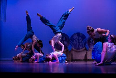 acro dancers doing a pose together on stage at thunderstruck