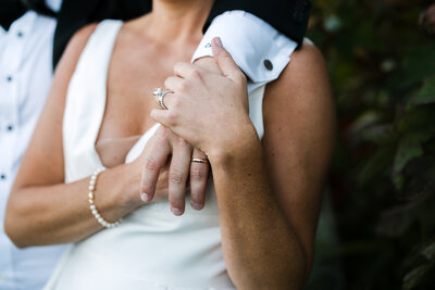 Bride and groom hand details and wedding rings at Wianno Club, Cape Cod wedding photographer