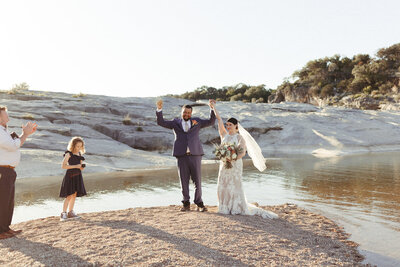 Couple eloping at Hamilton Pool in Texas