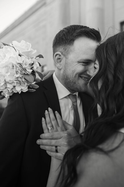 bride and groom couples pose in hotel bar for photoshoot.