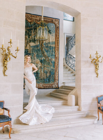 Bride and Groom Sit Together at Chateau de Courtomercaptured by Luxury Destination Wedding Photographer Katie Trauffer