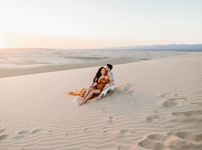 Romantic couple session at Glamis Sand dunes at California desert.