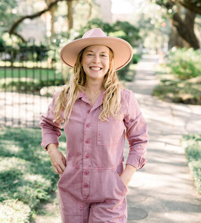 Sarah Weiss’ social media marketing client, Cindy, wearing a pink jumpsuit and hat