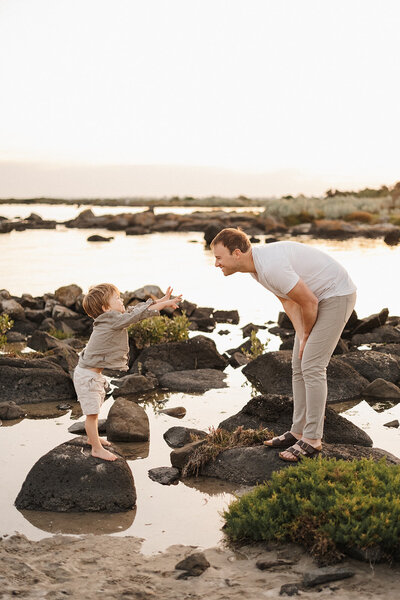 Family playing on rocks