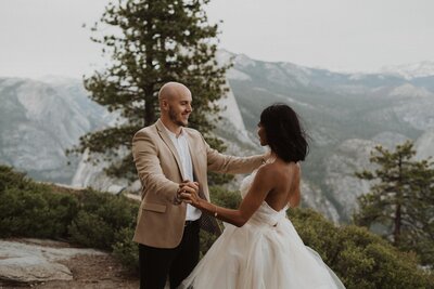 bride and groom exchange vows in yosemite