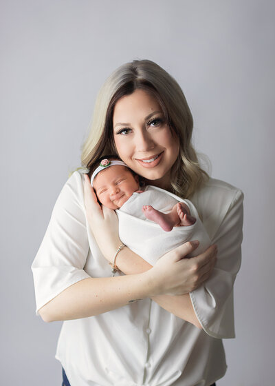 Mother holding newborn baby girl